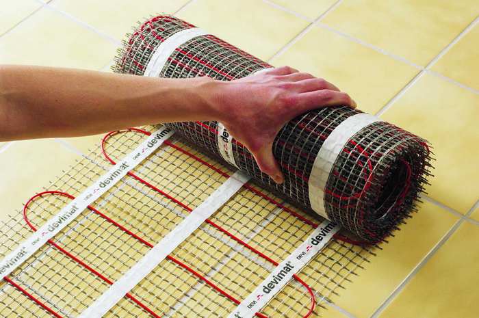 plancher chauffant électrique sous le tapis